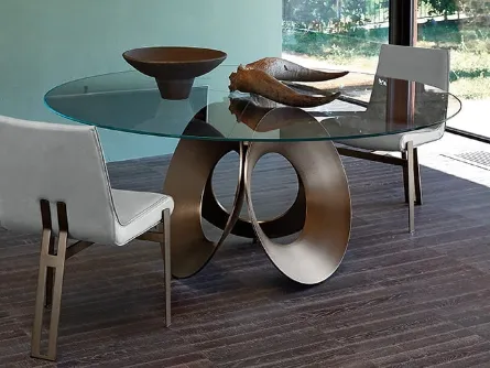 Tavolo rotondo con top in vetro e base scultorea in metallo Oracle di Arketipo