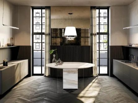 Cucina Design rotonda a isola che integra i fuochi nel piano Air Marble XGlass Calacatta Gold di Lago